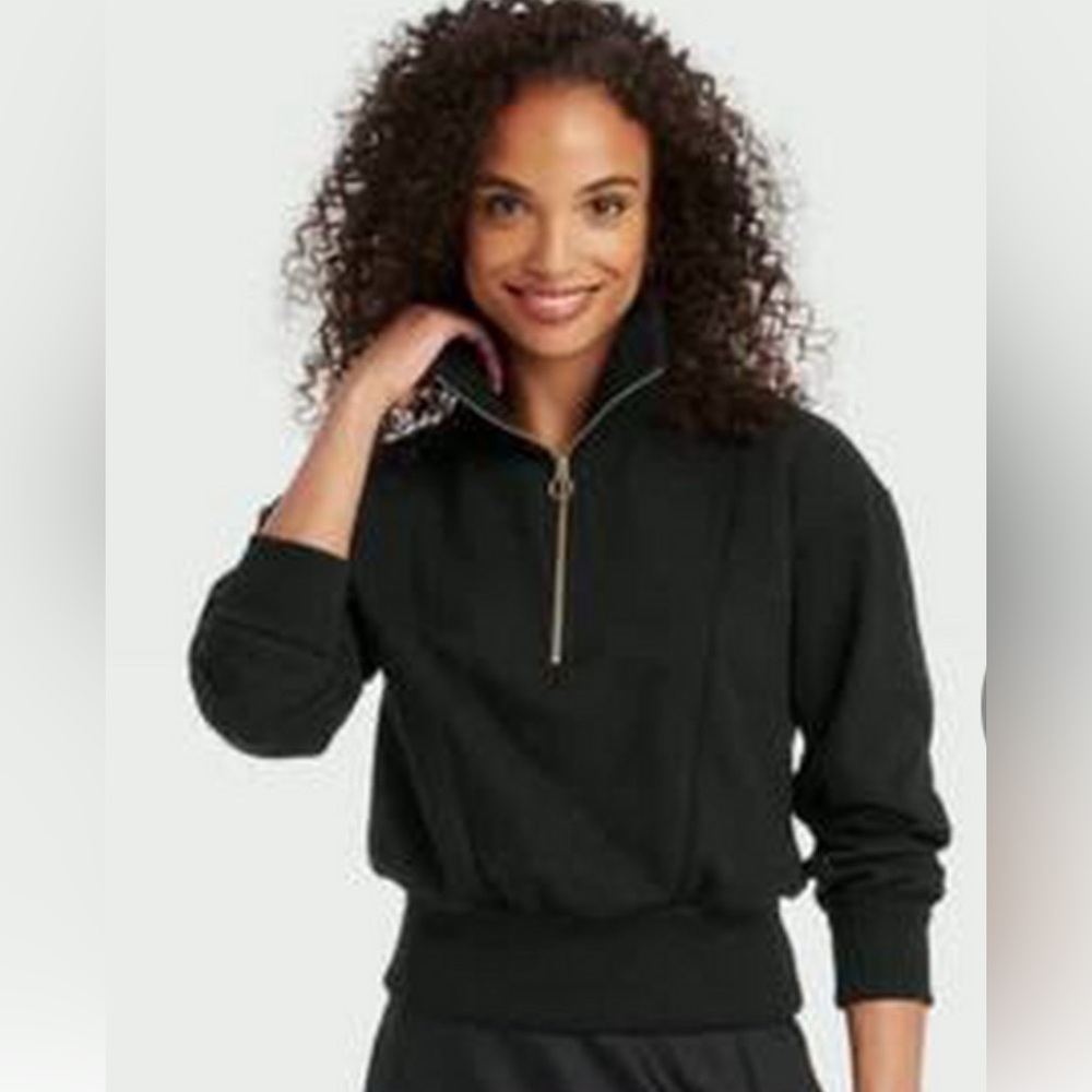 Black quarter zip sweatshirt with gold zipper